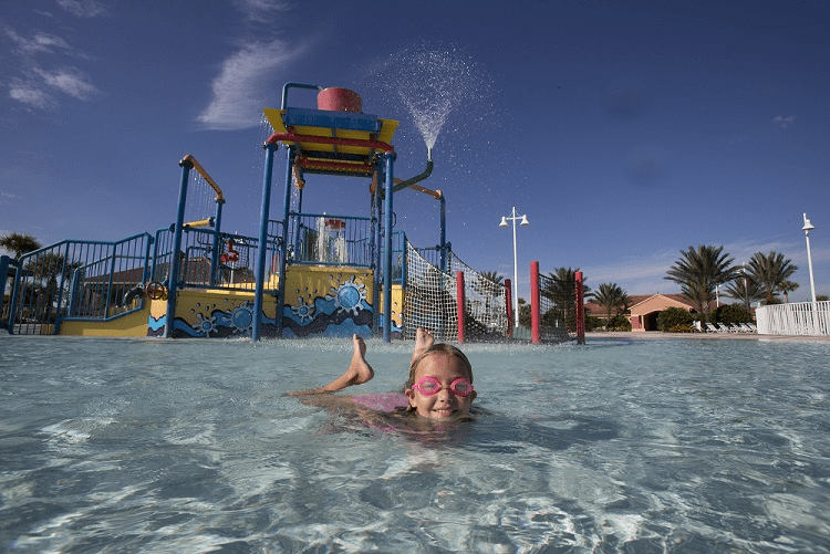 Water park with little girl swimming