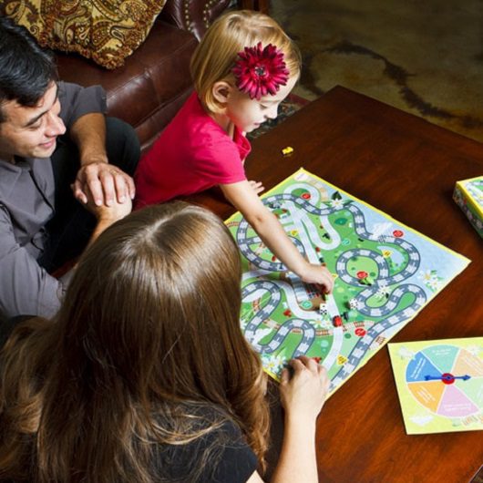 Family enjoying game night together Ave Maria, Florida