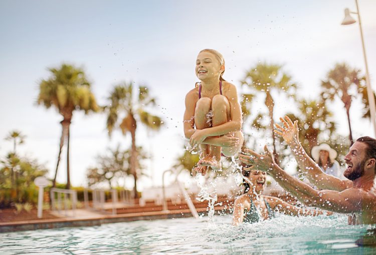 Child jumping into pool in Ave Maria, Florida