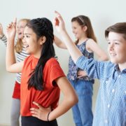 Group Of Children Dancing In Drama Class Together, Ave Maria Florida