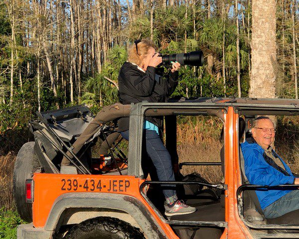 Photographer on an Orange Jeep