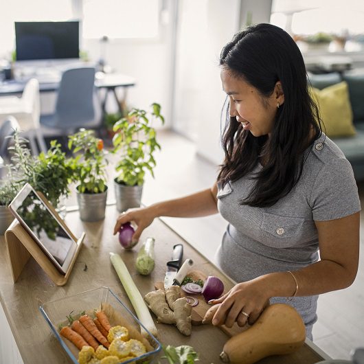 Asian women at home making healthy meal