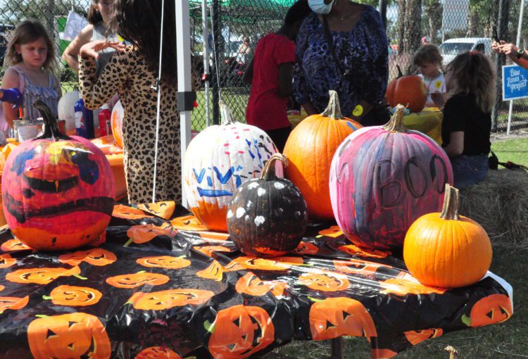 Painted and decorate pumpkins at event