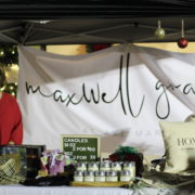 Women standing by table with products in Ave Maria, Florida