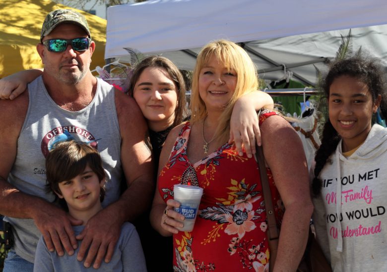 Family of five smiling