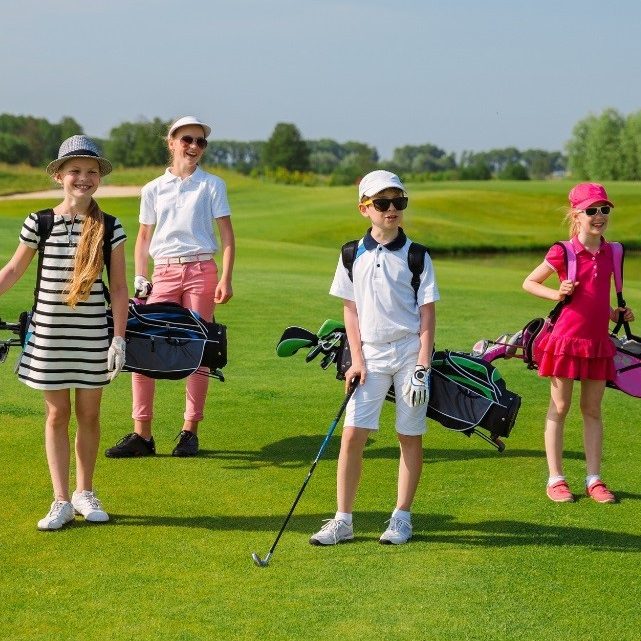 Four young children on golf course