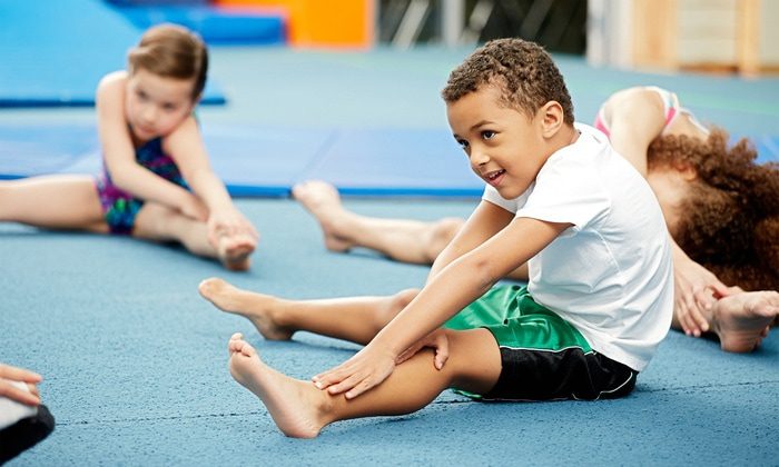 Young child stretching in a dance class in Ave Maria Florida