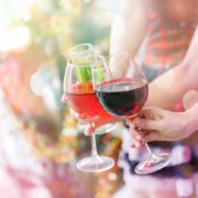 Friends celebrating Friends celebrating Christmas or New Year eve and hands hold a glass of champagne Drinking Stock Photo