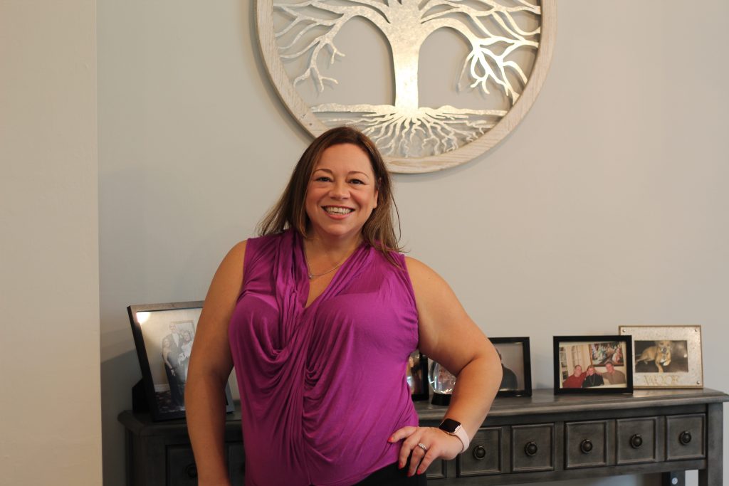 Woman standing smiling in her Pulte Home in Ave Maria Florida