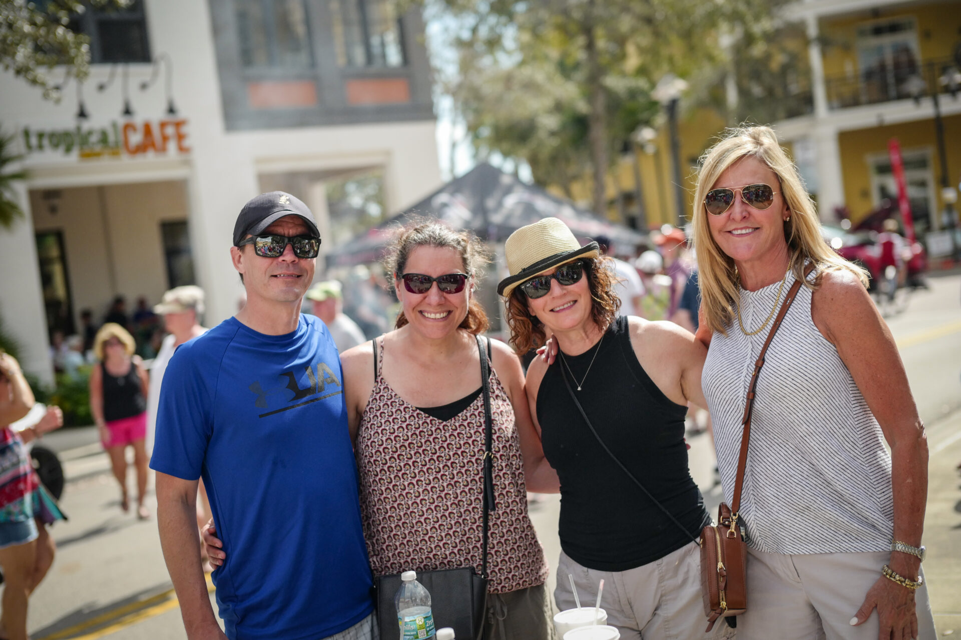 Friends smiling together at Ave Maria event