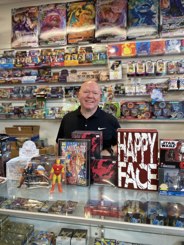 Man standing at toy store counter in Ave Maria Florida