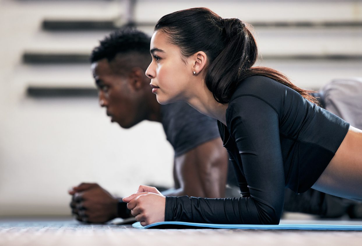 Two people doing planks