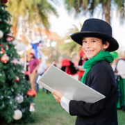 Young boy caroling in Ave Maria Town Center