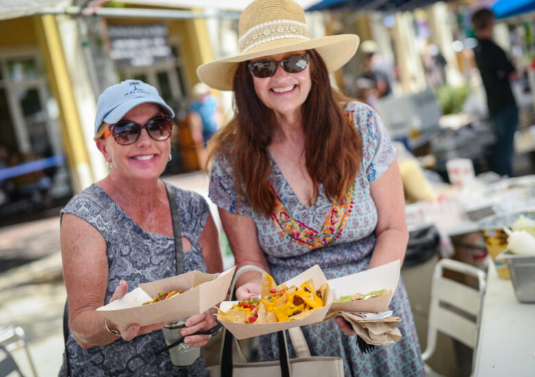 Two woman holding Mexican food in Ave Maria Florida