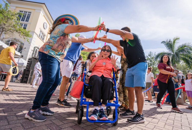 Crowd dances in the Ave Maria Town Center