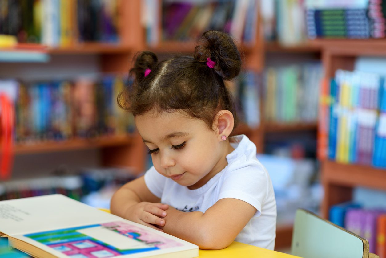 Child reads a book