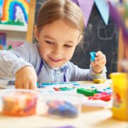 Child plays with crafts