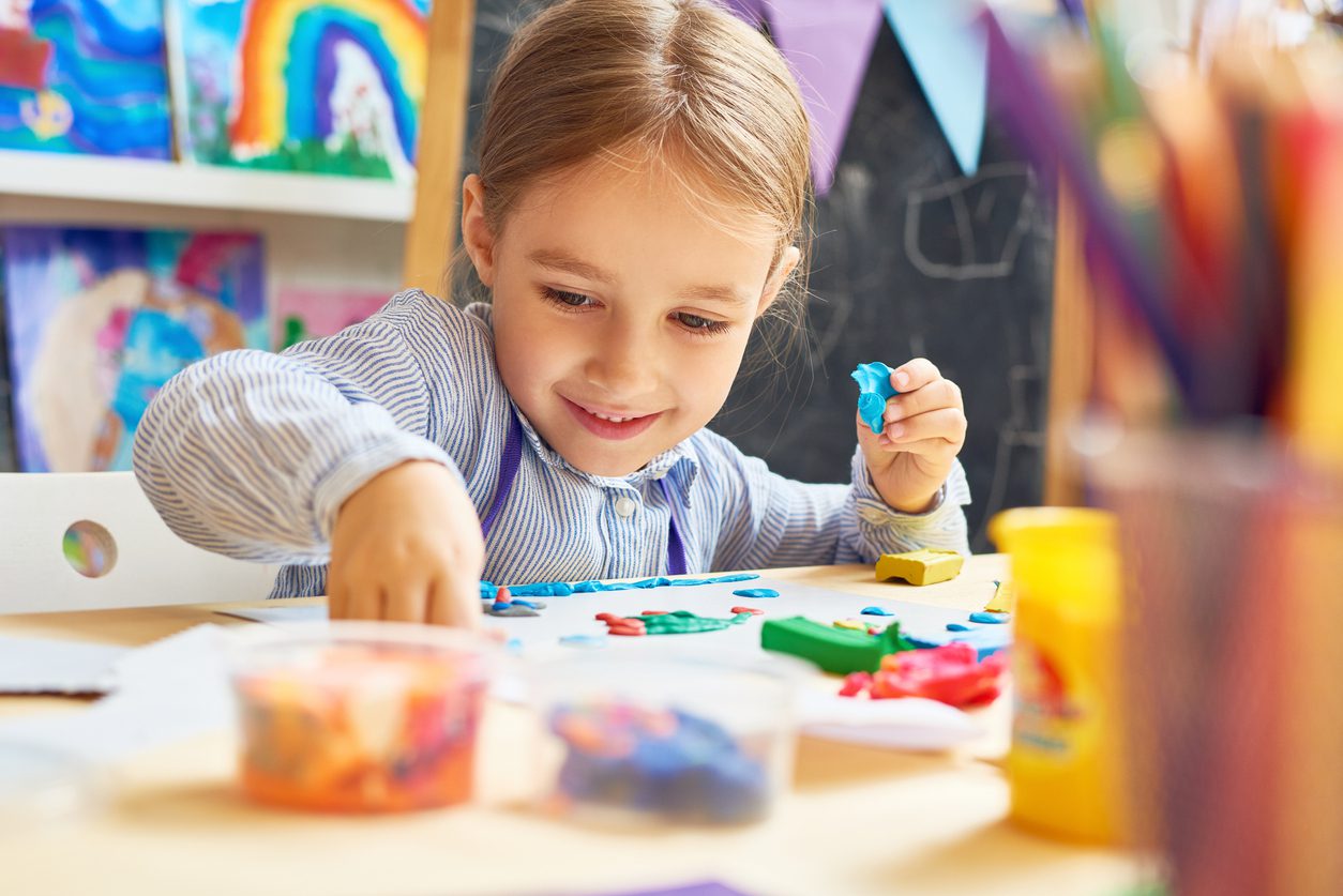 Child plays with crafts