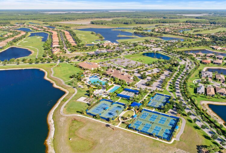 Aerial of Del Webb Naples amenity campus and homes in Ave Maria, FL