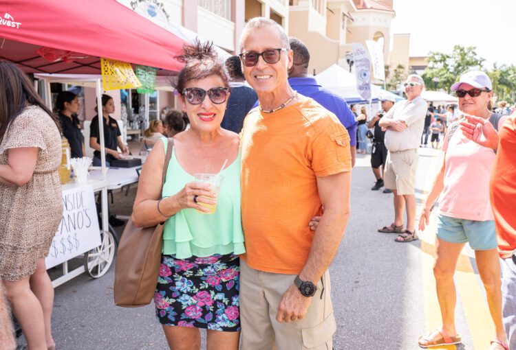 Couple smiling at camera while attending the 2023 Margarita & Taco Festival