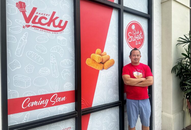 Franchisee owner, Phong Ho, stands outside his newest business, Vicky Bakery