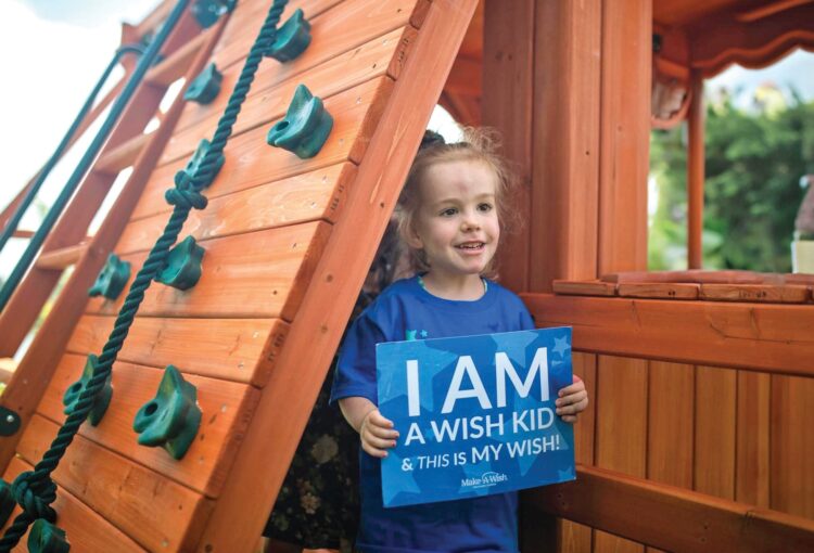 Ave Maria resident, Serafina Feger with her new playground set.