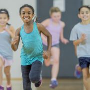 Group of kids running towards the camera