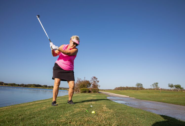 Barbara Mariano, event organizer of Kiss Cancer Goodbye swings golf club